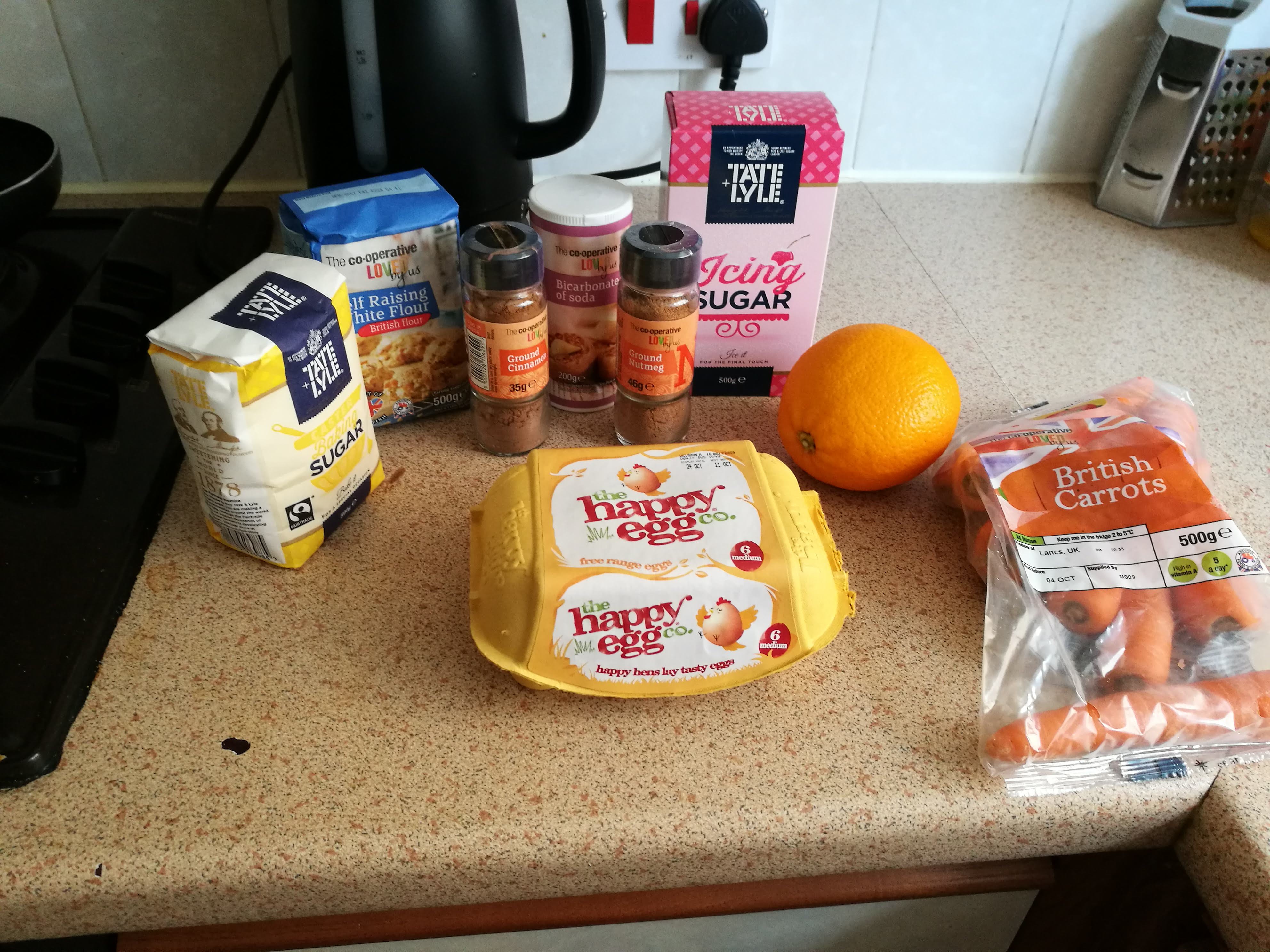Ingredients to make a carrot cake.