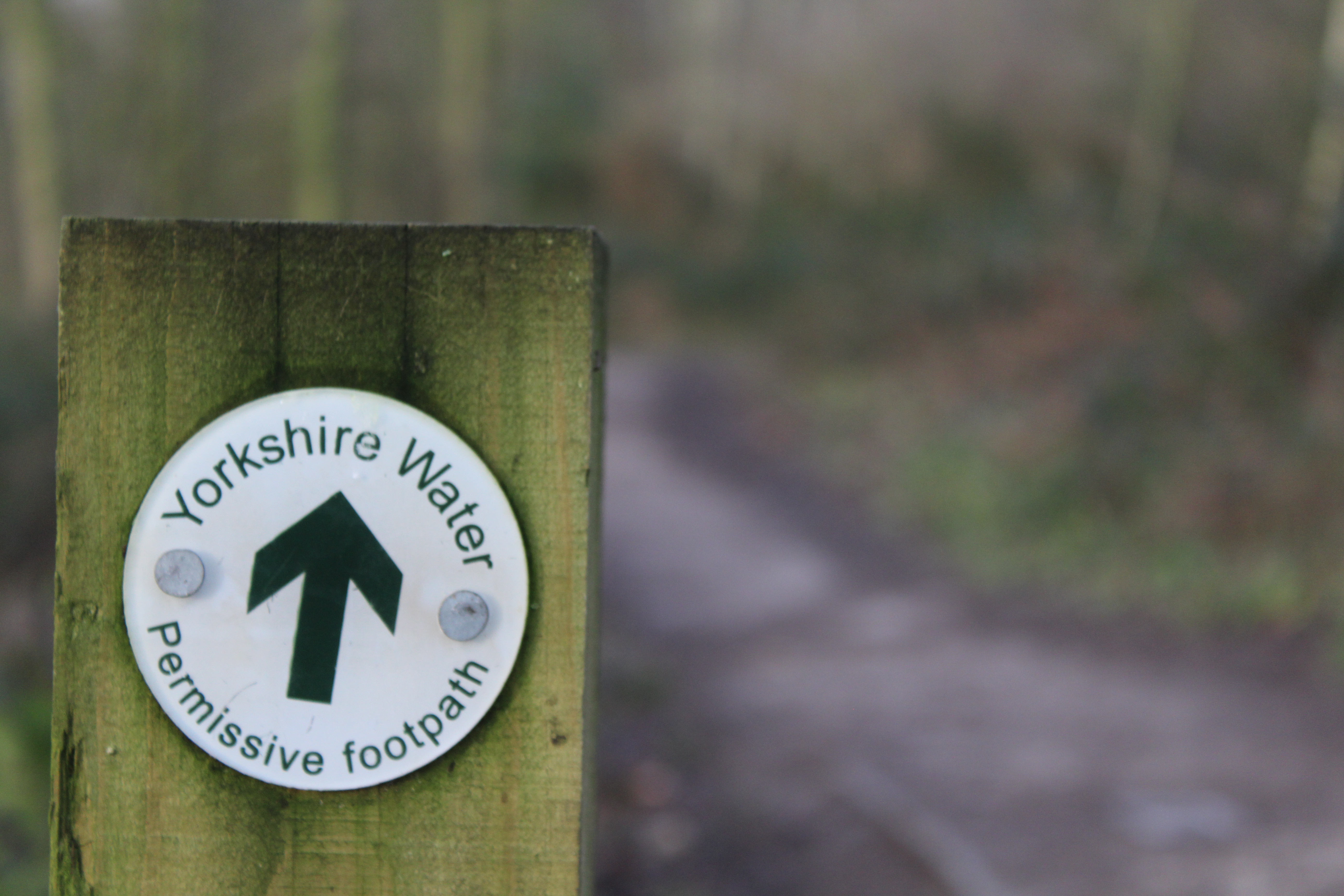 A wooden signpost reads "Yorkshire Water Permissive footpath".